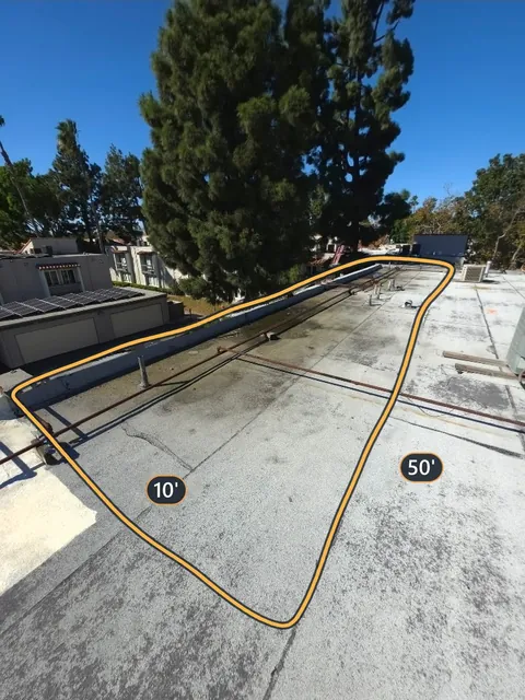 Flat roof section outlined and measured at 10 by 50 feet