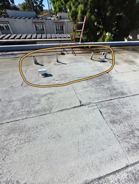 Flat roof with a group of vents outlined