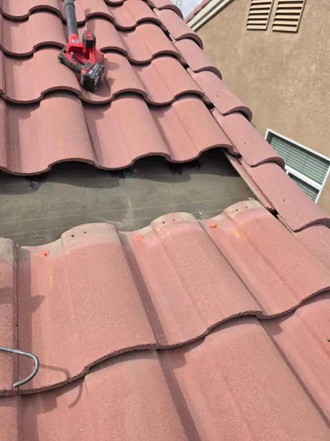 Roof tiles removed to expose the underlayment beneath
